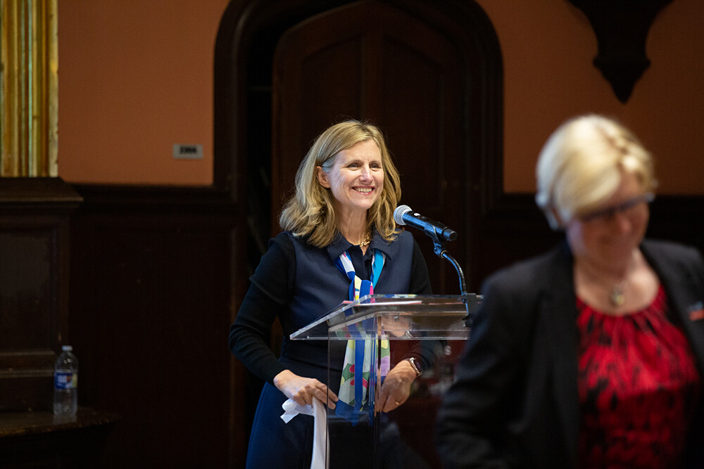 President Liz Magill speaks at a podium